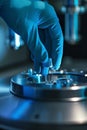 Precision Analysis: Glove-Handled Sample Loading into Scientific Device Royalty Free Stock Photo