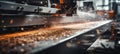 Precision cnc machine cutting metal sheet with clean edge, focus on falling metal shavings Royalty Free Stock Photo