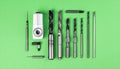 Precision CNC Machining Tools on a Green Background Royalty Free Stock Photo