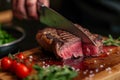 Precision in cooking Chefs hands cutting a large beef portion