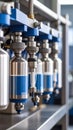 Precision dispensing system with metallic bottles containing blue liquid in a modern industrial setting Royalty Free Stock Photo