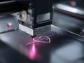 Precision Laser Engraving Machine Creating Intricate Heart Design on Material Surface with Vibrant Pink Light Royalty Free Stock Photo