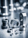 Precision-machined stainless steel mechanical components arranged on a reflective surface showcasing industrial engineering and Royalty Free Stock Photo