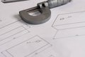 Precision micrometer placed on engineering technical drawings Royalty Free Stock Photo