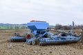 Precision seeder. Sowing equipment. Agricultural machinery sows on the field. Royalty Free Stock Photo