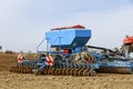 Precision seeder. Sowing equipment. Agricultural machinery sows on the field. Royalty Free Stock Photo