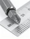 Precision Tool - Phillips Screwdriver Bit on a Ruler Royalty Free Stock Photo