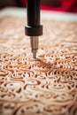 Precision wood carving cnc router creating detailed design with intricate lines and textures