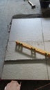 Precision and Workmanship: Laying Floor Tiles with Level and String Royalty Free Stock Photo