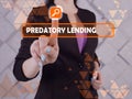 PREDATORY LENDING phrase on the screen. Marketing expert use cell technologies at office Royalty Free Stock Photo