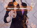 PREDATORY LENDING phrase on the screen. Marketing expert use cell technologies at office