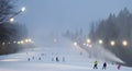 Predeal/Romania/ january 28, 2019: People skying under snow canon in the winter at the mountains