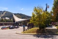 Predeal train station building on a sunny day, with Clabucet Ski Slope visible in the background