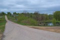 PREDTECHI / LIPETSK, RUSSIA - MAY 09, 2017: the road, a pond and a view of the house