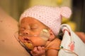 Preemie baby girl enjoying skin to skin with dad