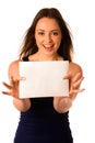 Preety assian caucasian woman holding a white card Royalty Free Stock Photo