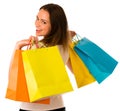 Preety young woman with colorful shopping bags isolated over white background Royalty Free Stock Photo