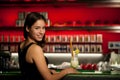 Preety young woman drinks cocktail in a night club Royalty Free Stock Photo