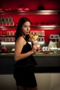 Preety young woman drinks cocktail in a night club Royalty Free Stock Photo