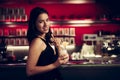 Preety young woman drinks cocktail in a night club Royalty Free Stock Photo