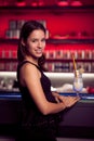 Preety young woman drinks cocktail in a night club Royalty Free Stock Photo