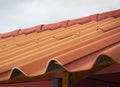 Prefabricated orange tile roof in simple house construction. Royalty Free Stock Photo
