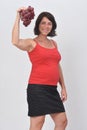 Pregnan woman holding grapes on white background