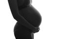 Pregnan woman in underwear cherish her belly. silhouette black a Royalty Free Stock Photo