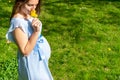 Pregnancy activity woman. Pregnant walking nature. Happy maternity mother in summer park. Baby belly. Healthy Pregnancy. Royalty Free Stock Photo