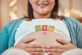 Pregnancy, blocks and hands on stomach for love, childcare and motherhood support. Pregnant woman, happy baby Royalty Free Stock Photo