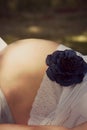 Pregnancy bump bely with blue flower