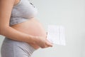 Pregnancy care. cardiotocography fetal heartbeat examination. pregnant woman holds in her hands the results Cardiotocography of Royalty Free Stock Photo