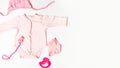 Pregnancy and childbirth concept. Newborn clothes and essentials. Banner. copy space