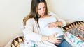 Pregnancy contractions time. Childbirth time, contractions pain. Pregnant holding baby belly, woman watching clock Royalty Free Stock Photo