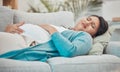 Pregnancy, cramps and woman with stomach pain on sofa holding abdomen in pain, discomfort and physical strain Royalty Free Stock Photo