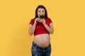 Pregnancy Cravings. Happy Young Pregnant Woman Biting Chocolate Bar Royalty Free Stock Photo