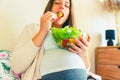Pregnancy eating healthy salad. Happy pregnant woman eating nutrition food. People lifestyle food concept. Royalty Free Stock Photo