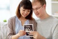 Close up of happy couple with baby ultrasound Royalty Free Stock Photo