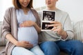 Close up of couple with baby ultrasound images Royalty Free Stock Photo