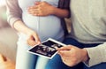 Close up of couple with baby ultrasound images Royalty Free Stock Photo