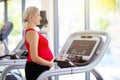 Pregnancy gym fitness. Pregnant woman exercising