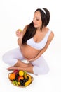 Pregnancy, health and beauty. Proper nutrition. Vitamins and fruit for pregnant women Royalty Free Stock Photo