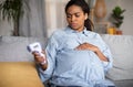 Sick Pregnant Black Lady Having Fever Holding Thermometer At Home Royalty Free Stock Photo