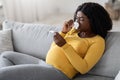 Young pregnant black woman feeling sick with high fever Royalty Free Stock Photo