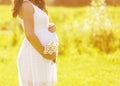 Pregnancy lovely woman with flowers
