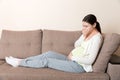 Pregnancy Morning Sickness. Pregnant Woman Having Nausea Feeling Bad in Sofa at the Home Royalty Free Stock Photo