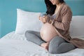 Pregnancy, motherhood and expectation concept - smiling pregnant woman drink some milk Royalty Free Stock Photo