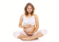 Pregnancy, motherhood, fitness and yoga concept - happy pregnant