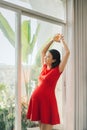 Pregnancy, motherhood, people and expectation concept - close up of happy pregnant woman with big belly at window Royalty Free Stock Photo