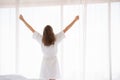 Pregnancy, motherhood, people and expectation concept - close up of happy pregnant woman opening window curtains Royalty Free Stock Photo